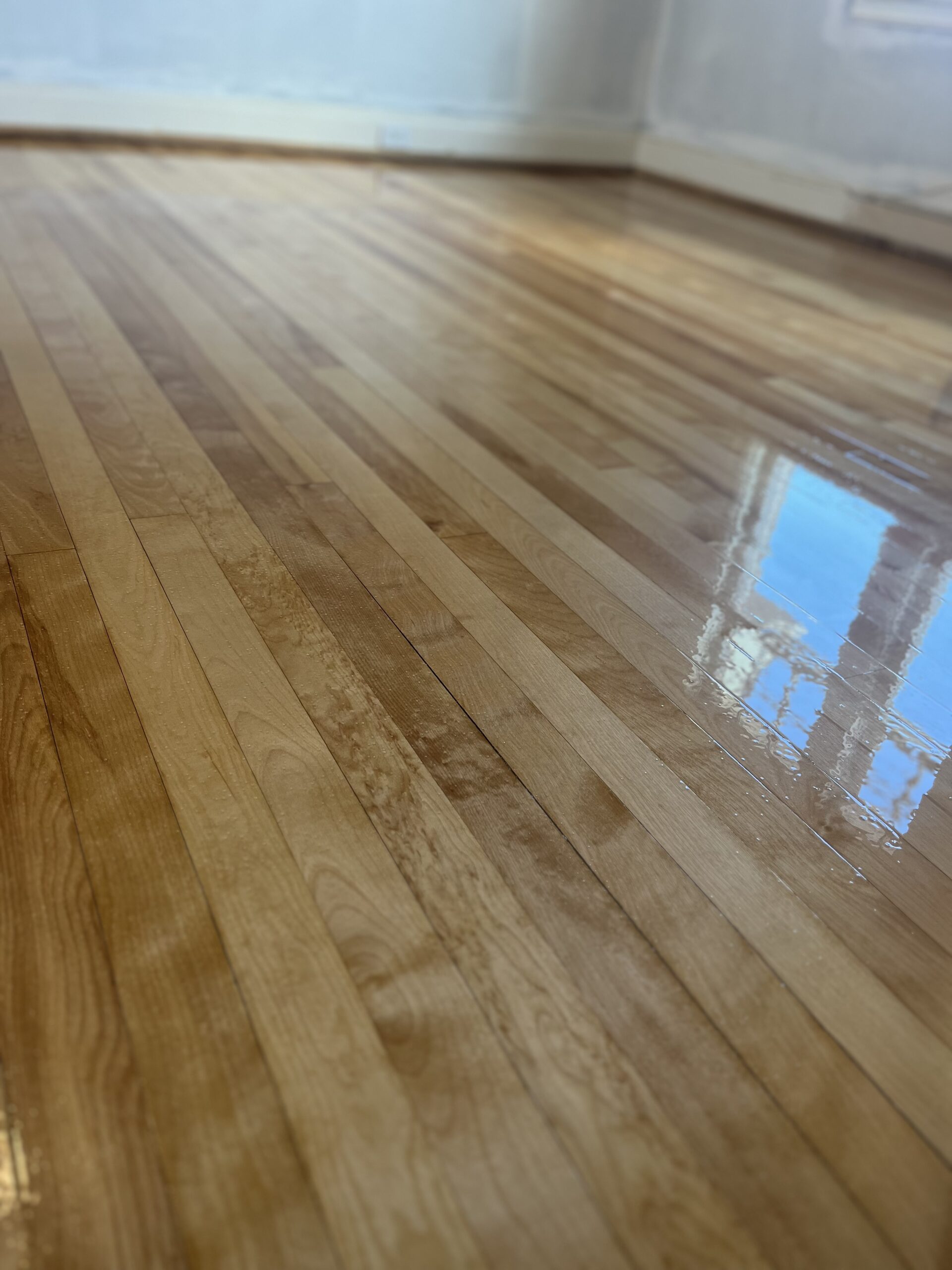 Shiny hardwood floor refinished